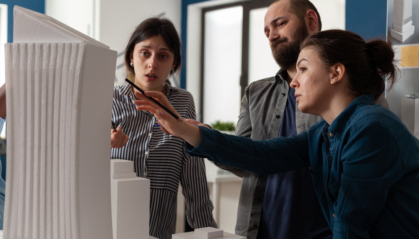 professional-team-architects-analyzing-maquette